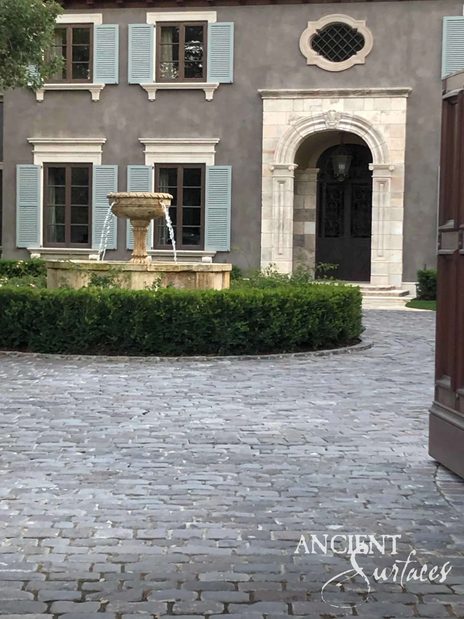 Reclaimed limestone and basalt cobblestones with naturally worn tops
